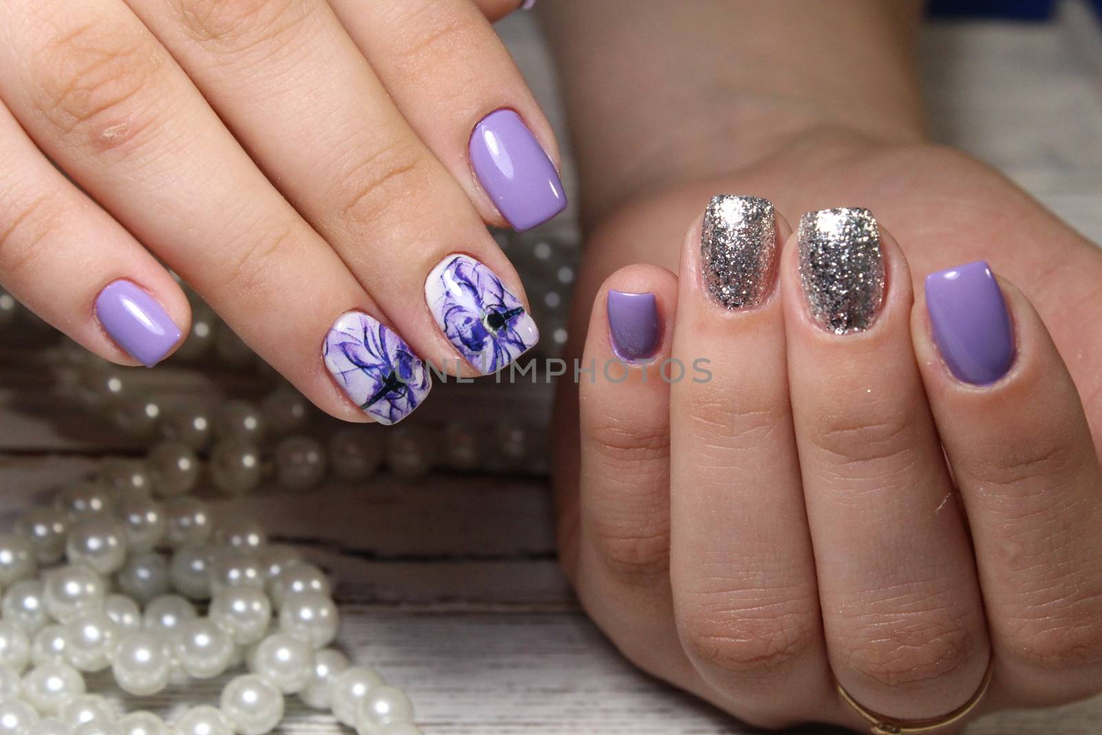 fashionable gray manicure on beautiful long nails