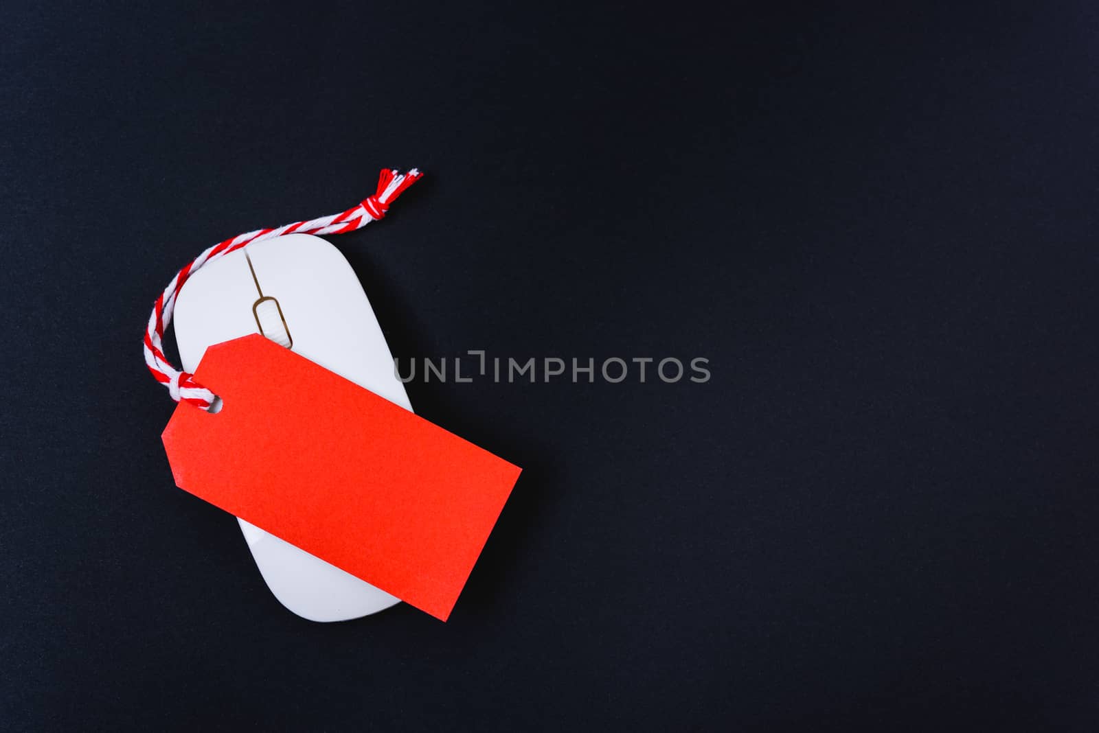 Online shopping Blank red tag on white mouse with black background