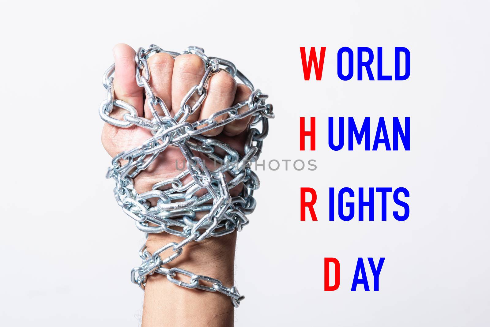 Chained fist hands with WORLD HUMAN RIGHTS DAY text on white background, Human rights day concept