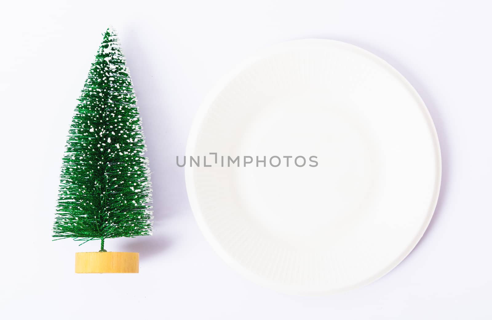 Happy New Year and Christmas day, top view flat lay composition decoration have branch tree and white round on white background with copy space for your text