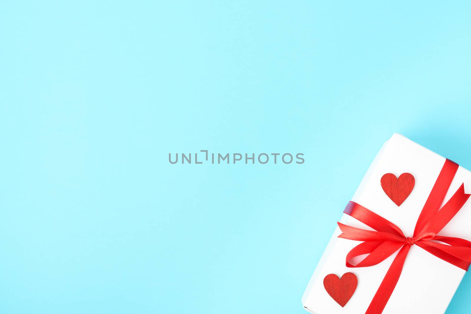 Valentine's Day Concept, Top view Flat lay, gift box and red heart on blue background with copy space for your text