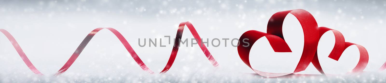 Red heart shaped ribbon on white bokeh background Valentines day design