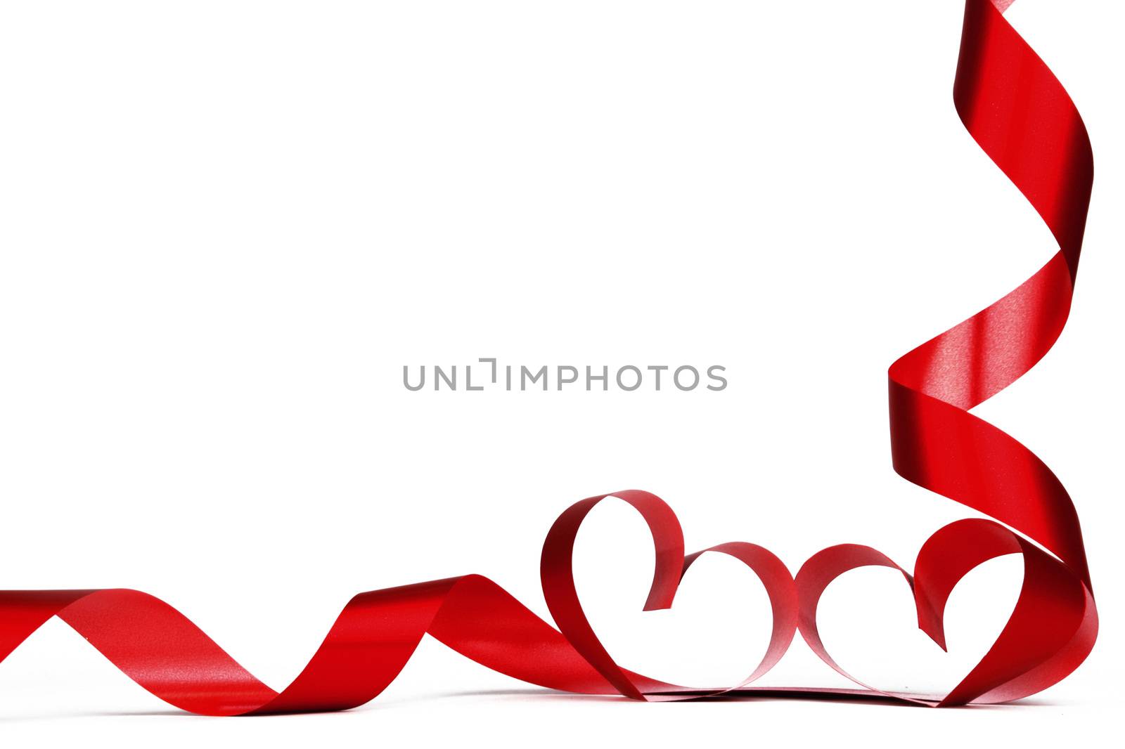 Valentines day frmae made of red ribbon hearts, isolated on white