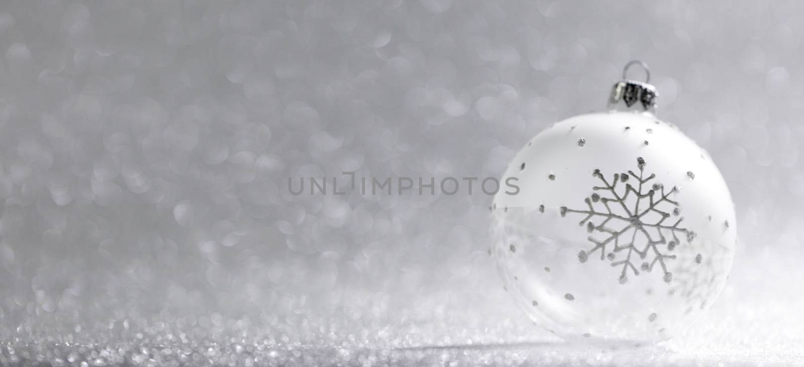Christmas ball on silver background by Yellowj