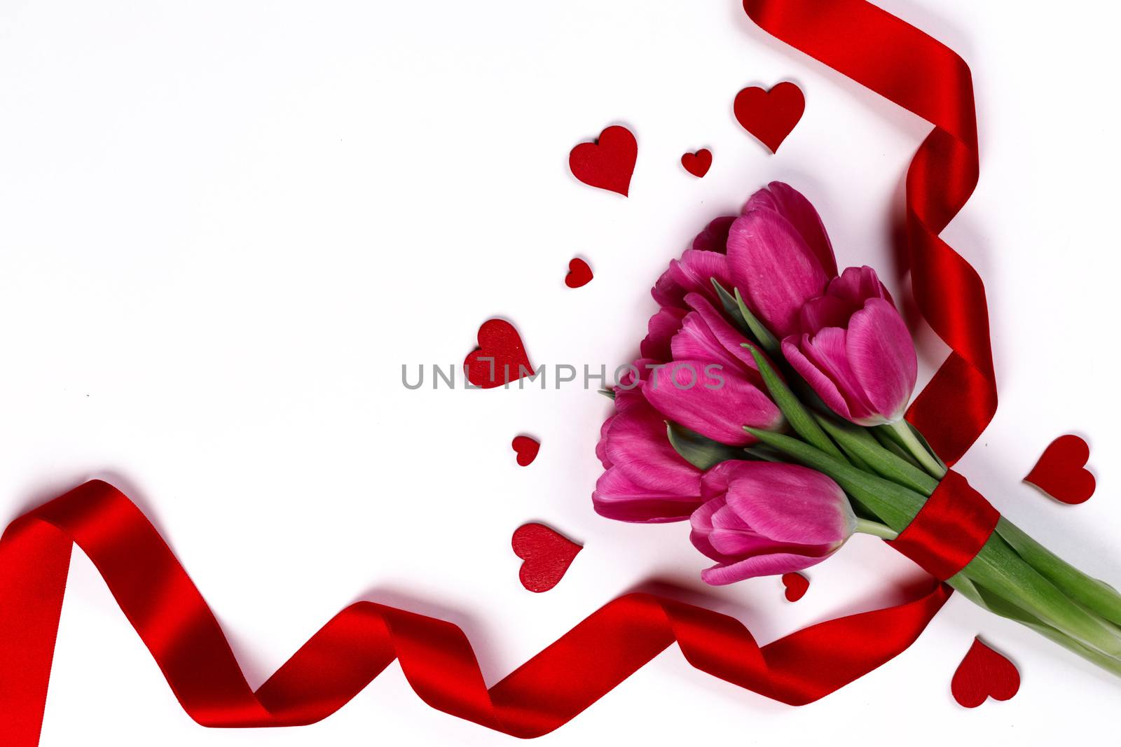 Valentines day hearts and pink tulip flowers isolated on white background