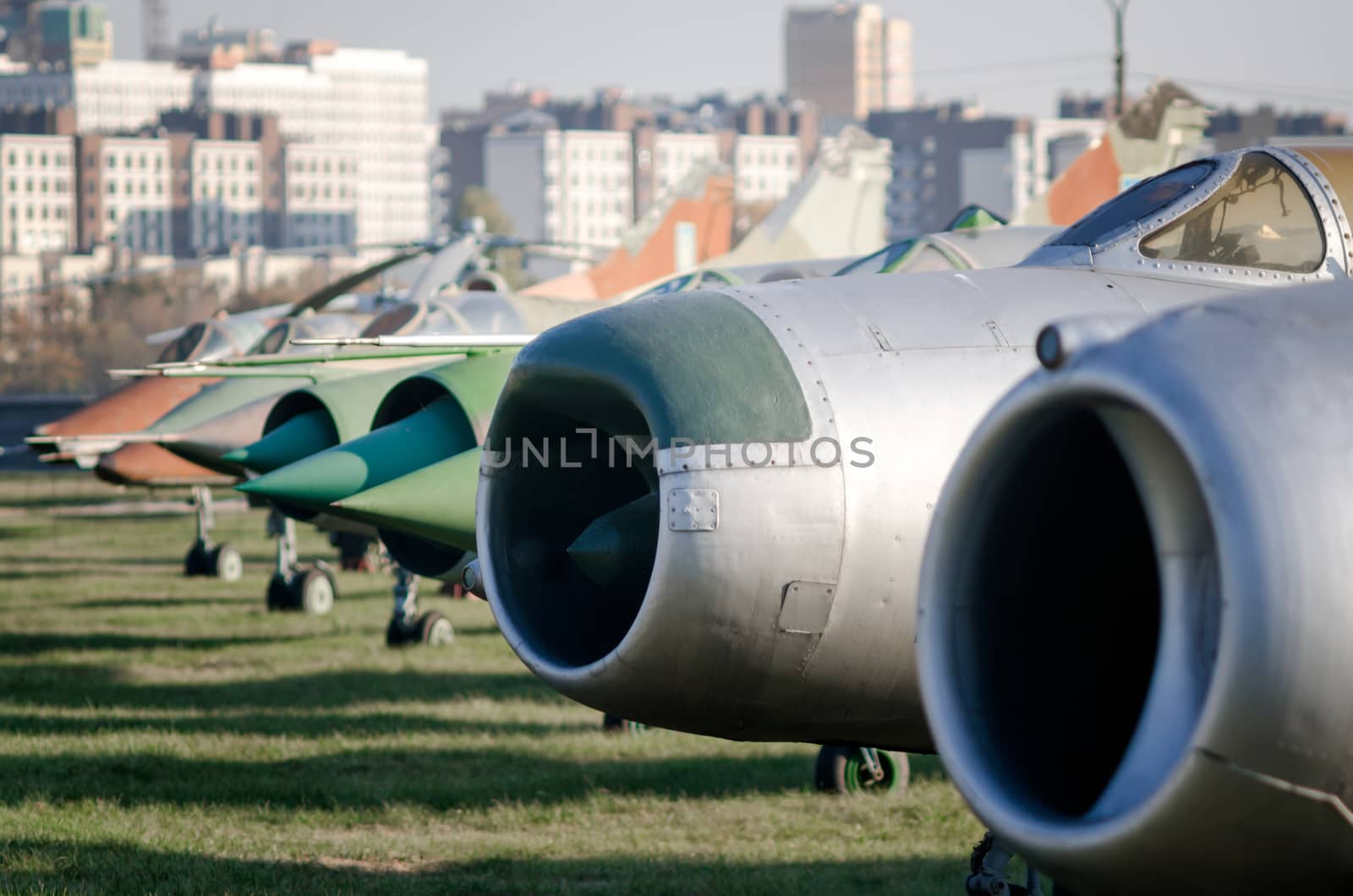 exhibition museum of the old army combat fighter aircraft against the background of the city