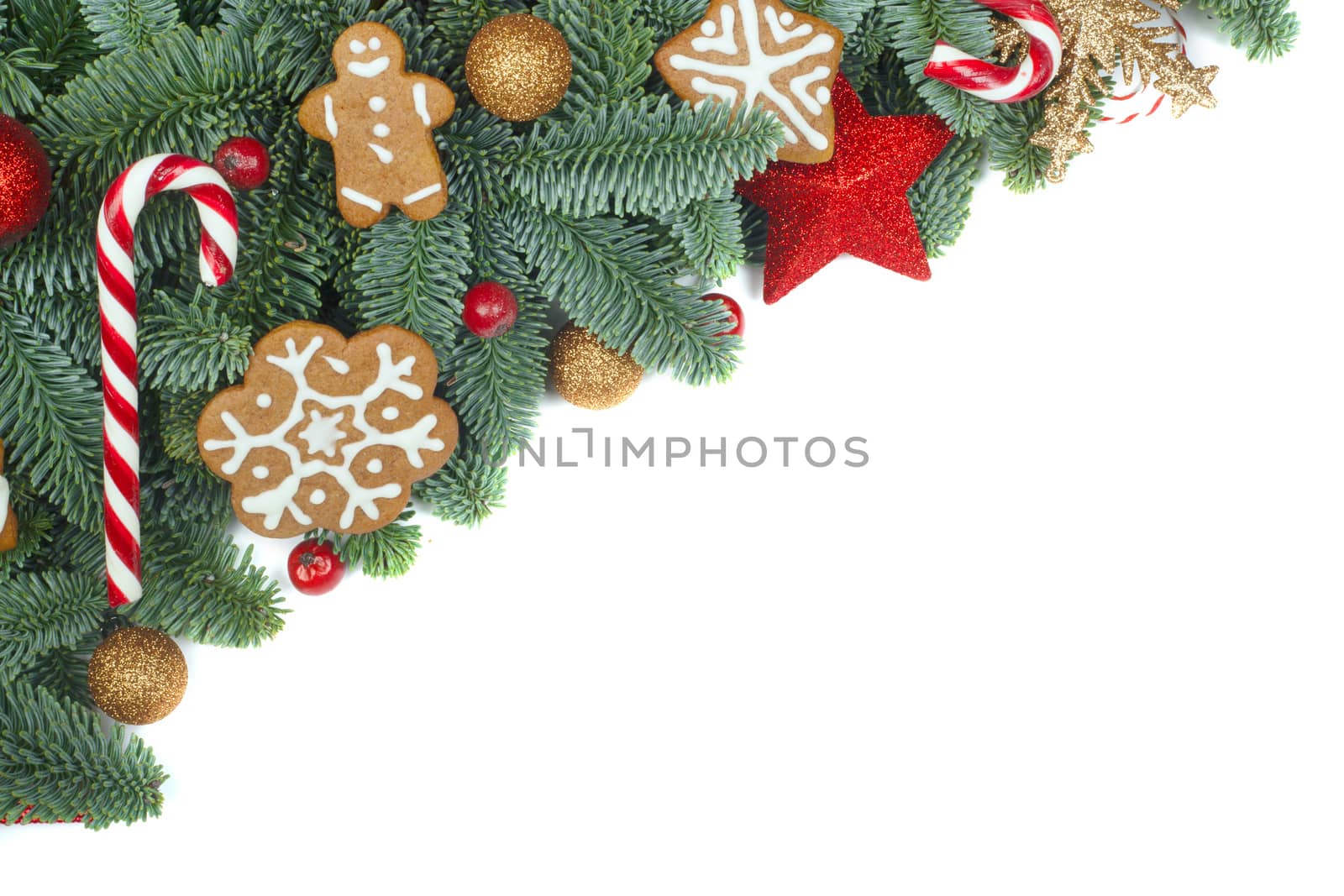 Christmas design boder frame greeting card of noble fir tree branches cookies and baubles isolated on white background