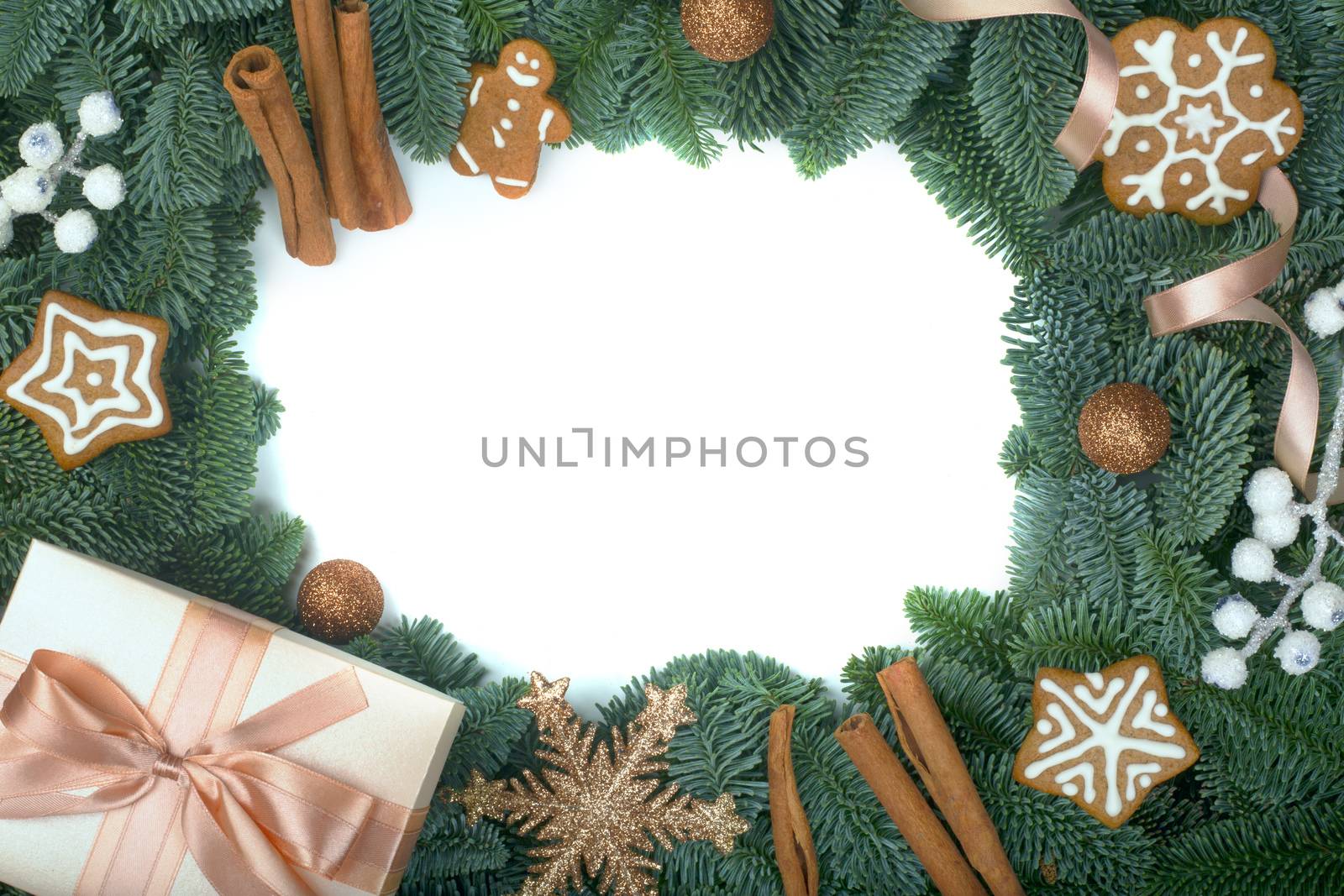 Christmas design boder frame greeting card of noble fir tree branches gift and gingerbread cookies isolated on white background