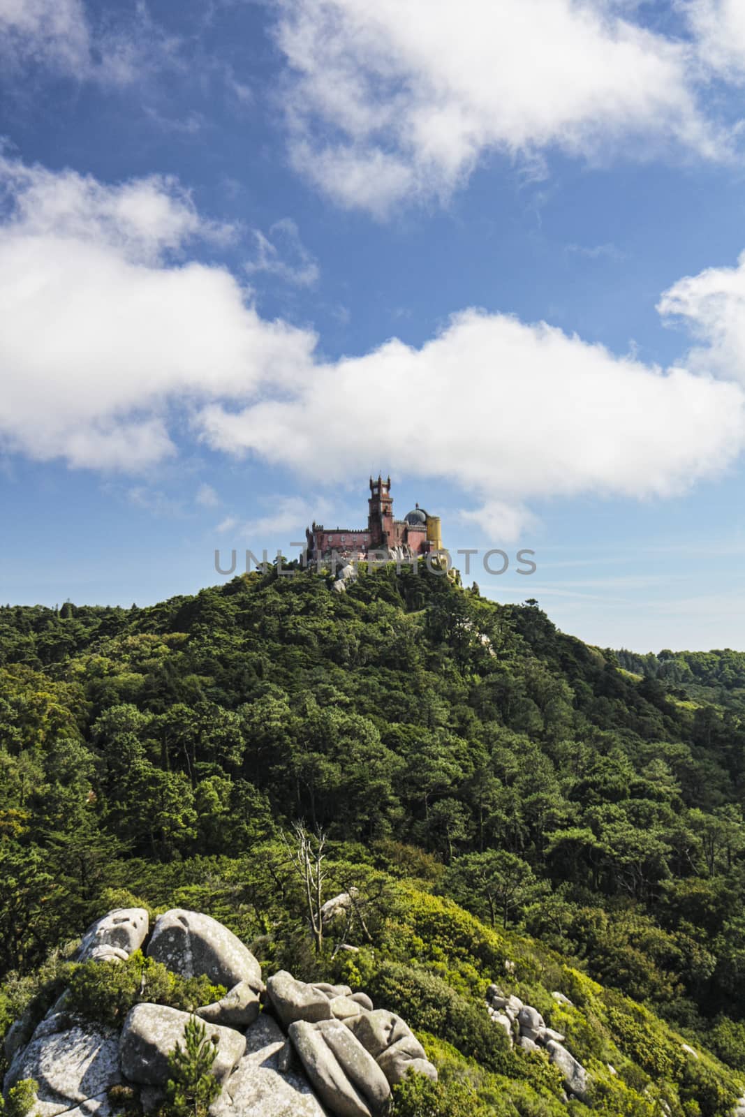 View of Palacio da Pena on the top of the mountain from Castelo dos Mouros