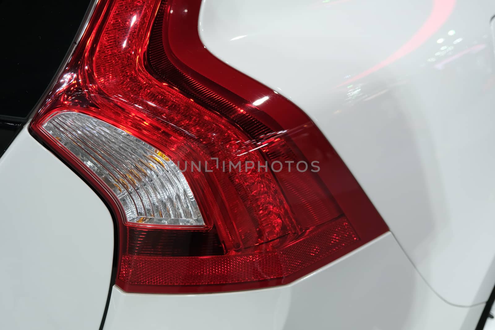 Rear light of a modern hatchback detail car by peerapixs