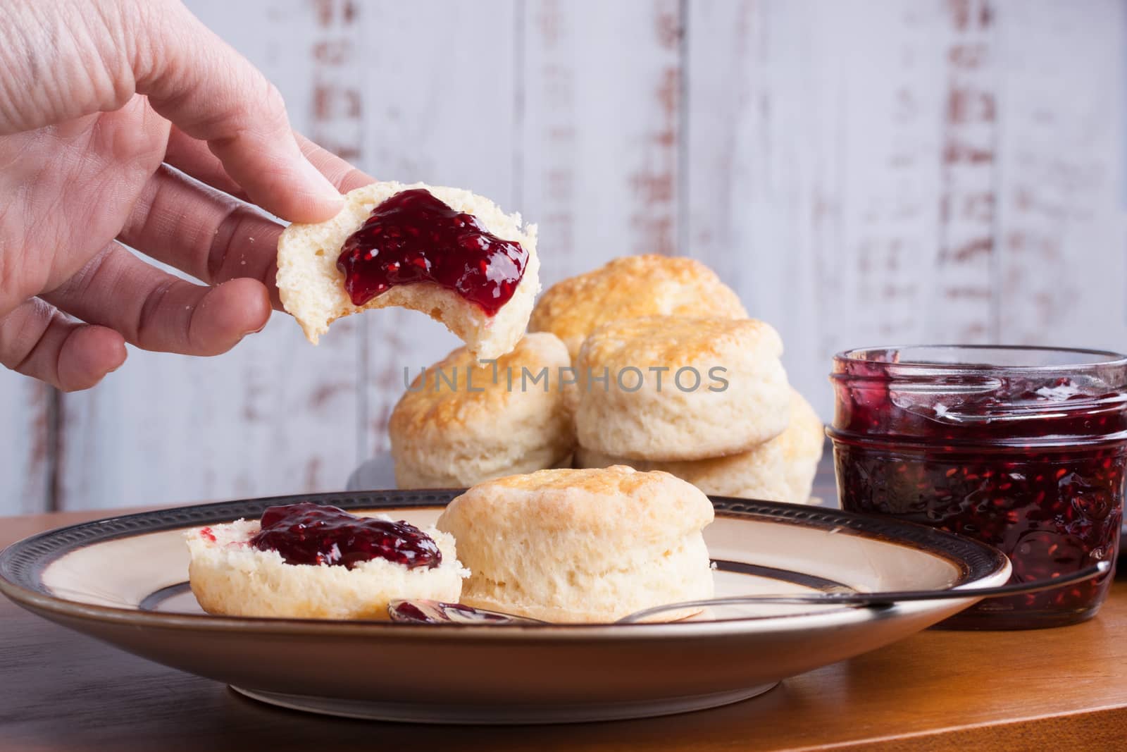 Fresh homemade traditional English scones in a plate ready for the four o'clock tea snack