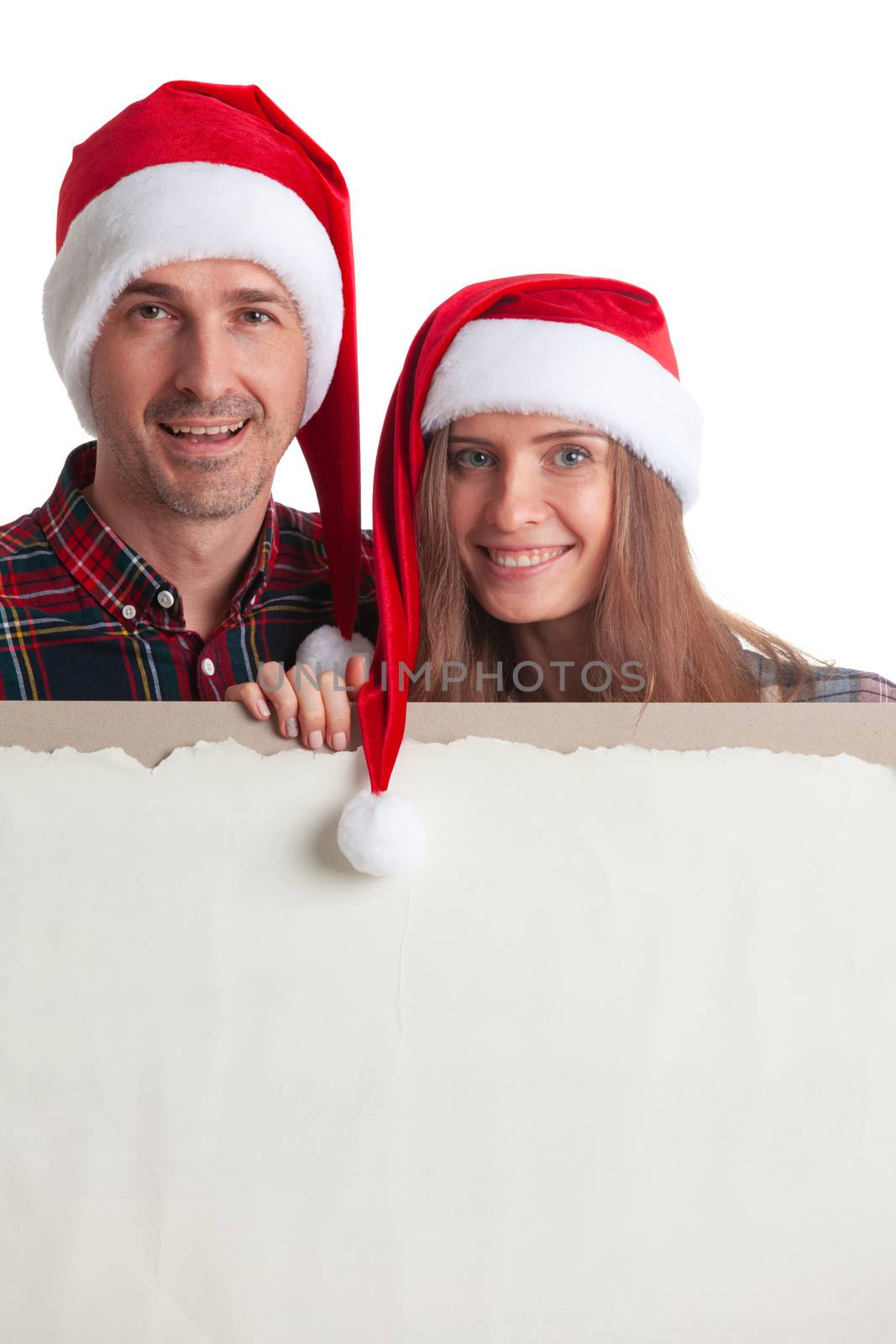 Couple in Santa hats with banner by ALotOfPeople