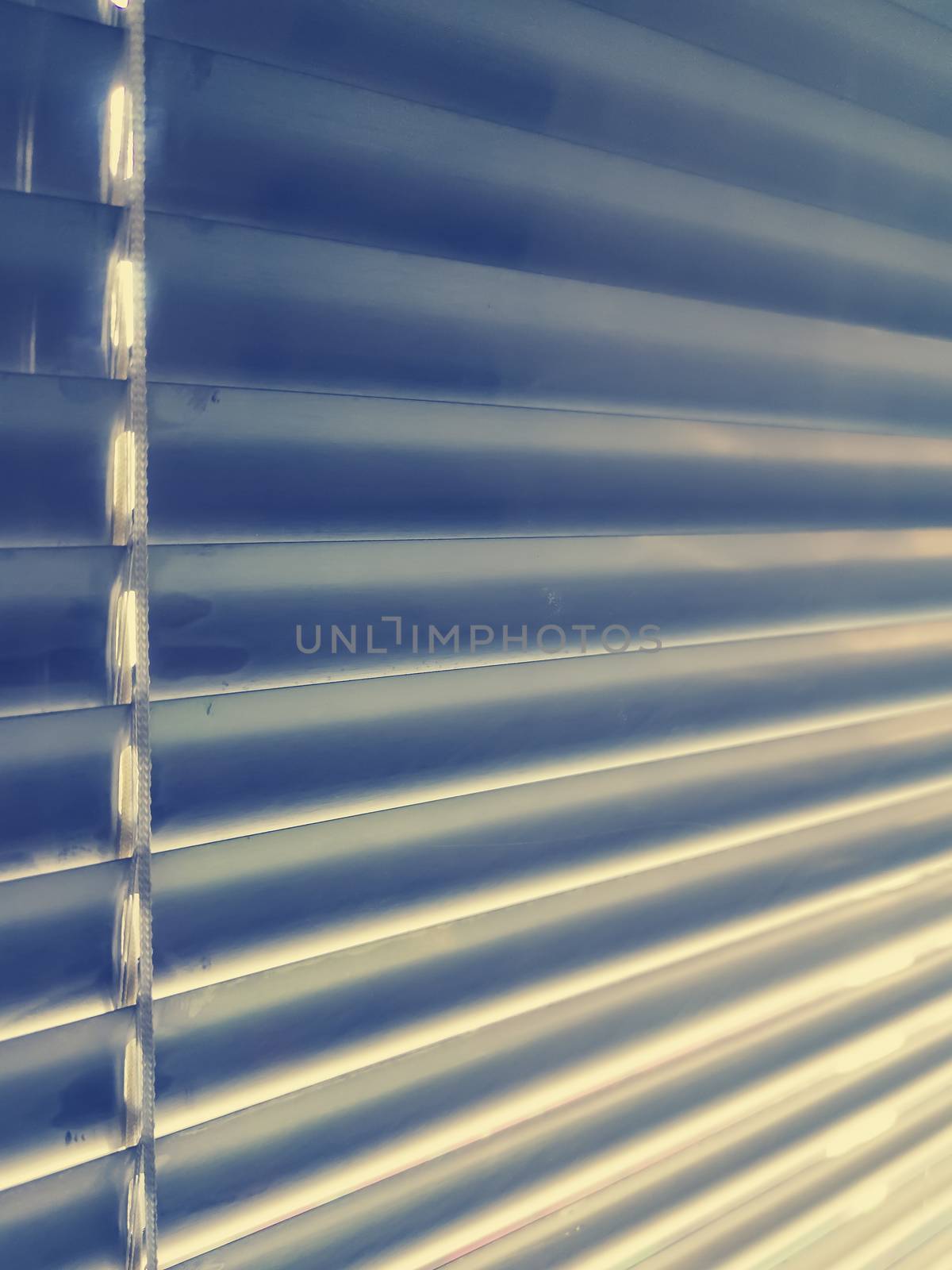 Sunblinds Silver aluminum louver on window horizontal pattern. Shutters On glass In The Office or home  interior