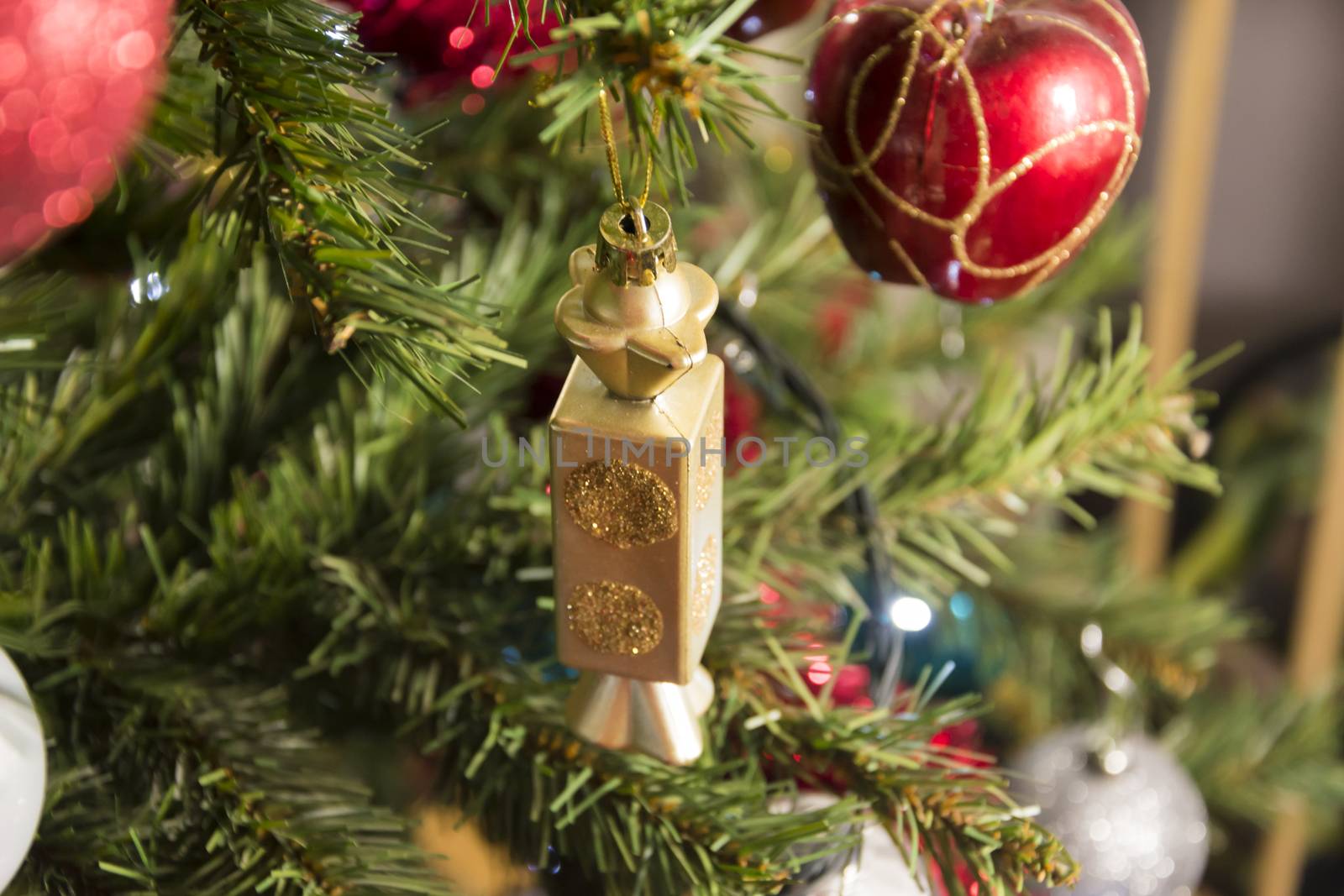 Candy shape Christmas ornament on pine tree, detail, close up. xmas Decorations Balls On evergreen tree