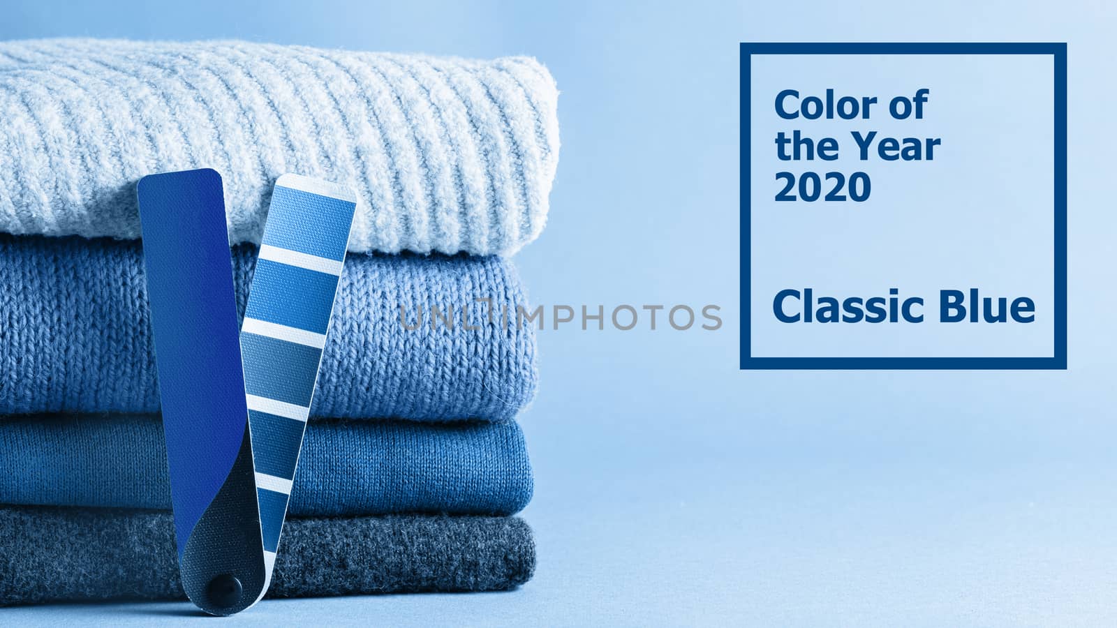 Stack of sweaters and color fun palette in classic blue 2020 color. Color of year 2020 concept for fashion and clothing industry. Banner