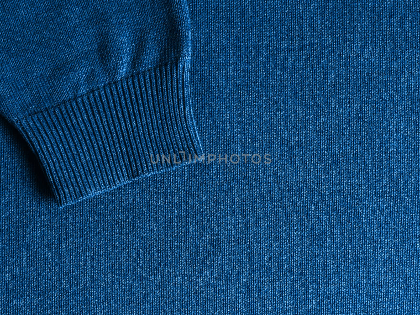 Sweater in classic blue 2020 color. Color of year 2020 concept for fashion and clothing industry. Copy space for text or design