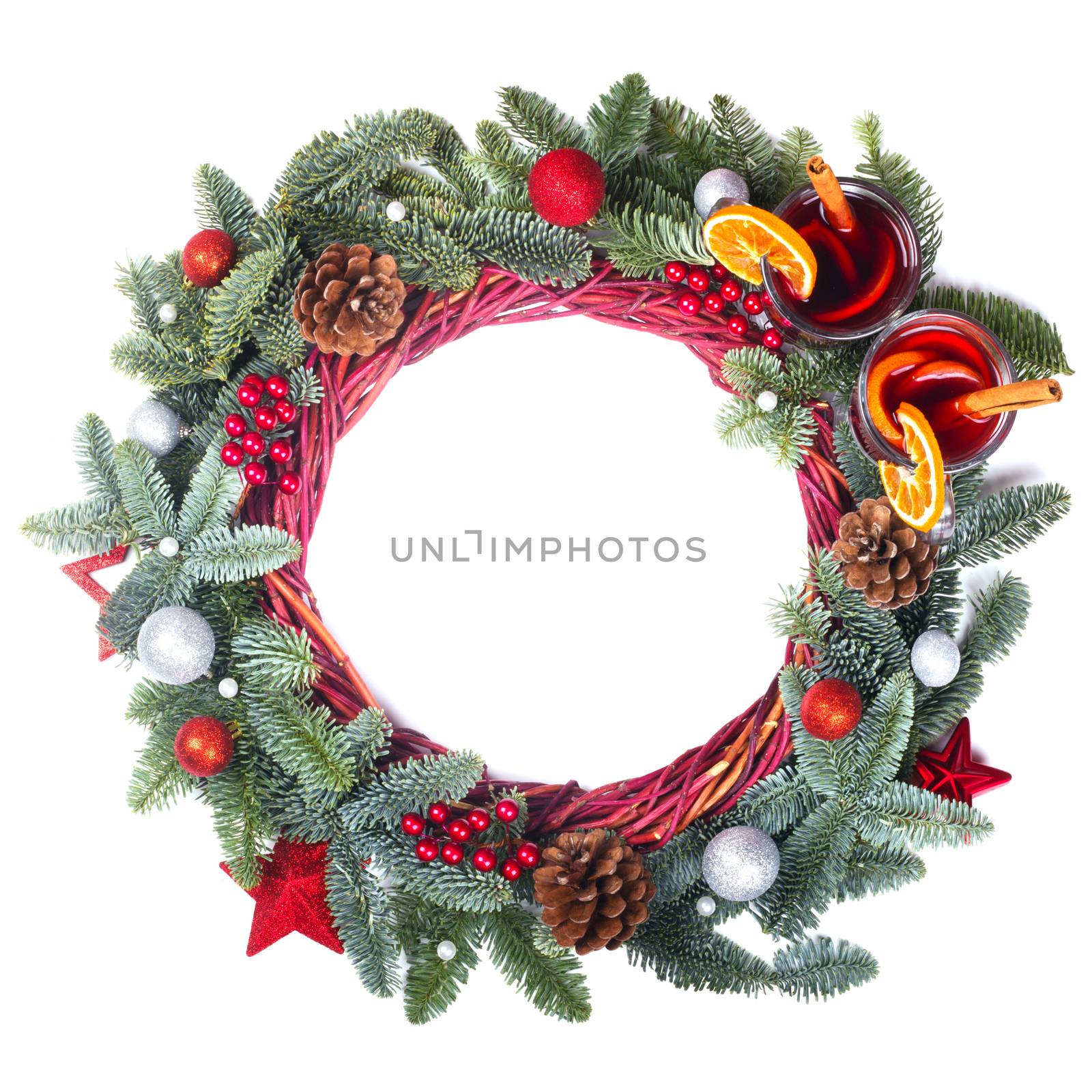 Christmas decorative wreath with noble fir tree twigs pine cones baubles and mulled wine isolated on white background with copy space for text