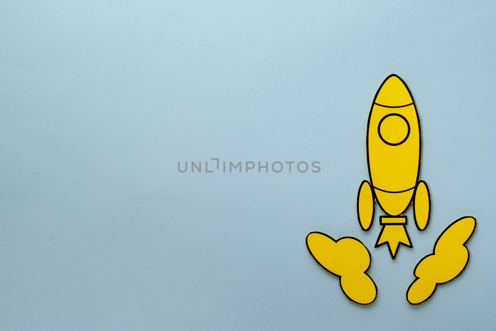 Yellow cartoon rocket zooming through space a blue background by sergii_gnatiuk