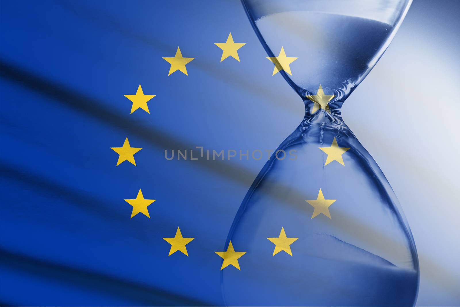 Composite image of the EU flag and hourglass in a concept of passing time and countdown to a deadline