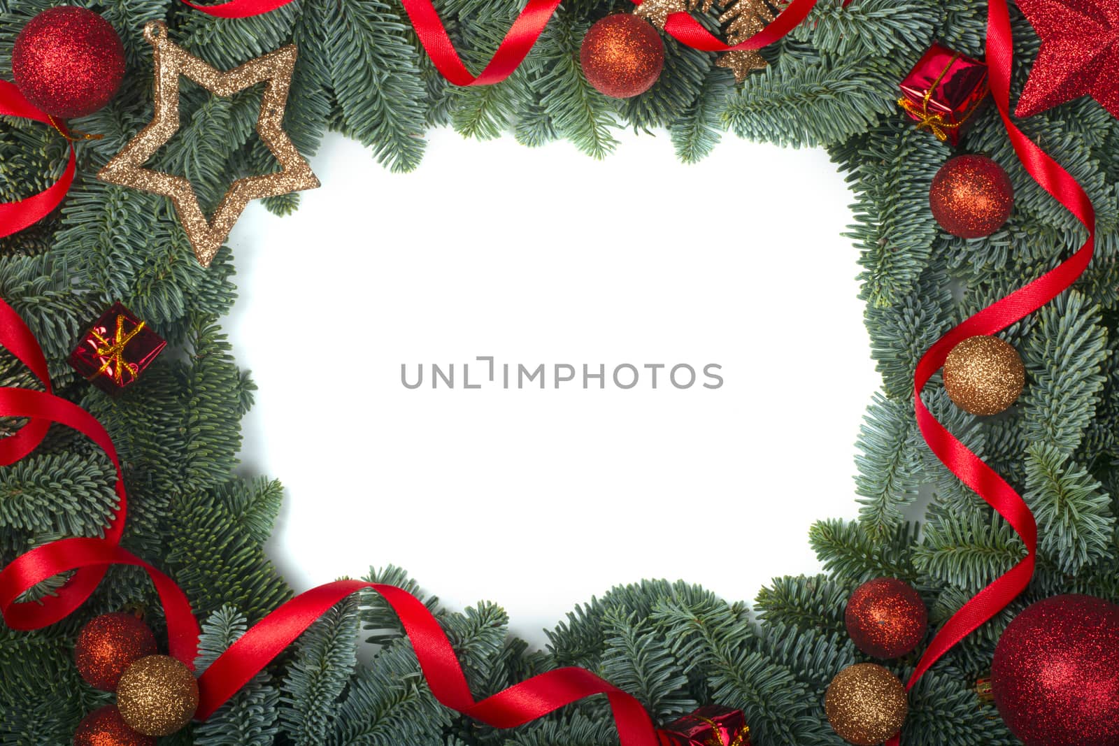 Christmas design boder frame greeting card of noble fir tree branches and red baubles isolated on white background