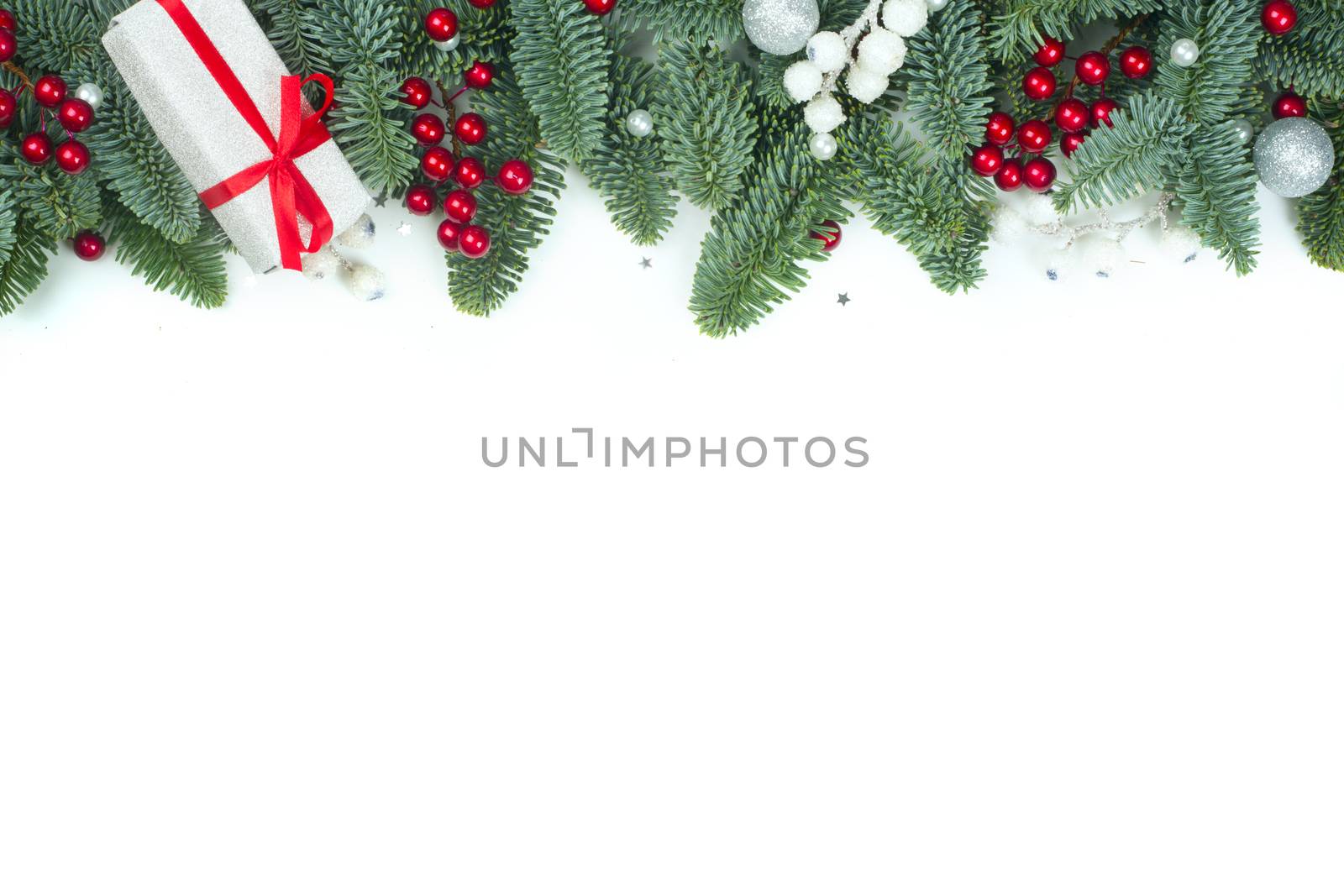 Christmas design boder frame greeting card of noble fir tree branches gift and baubles isolated on white background