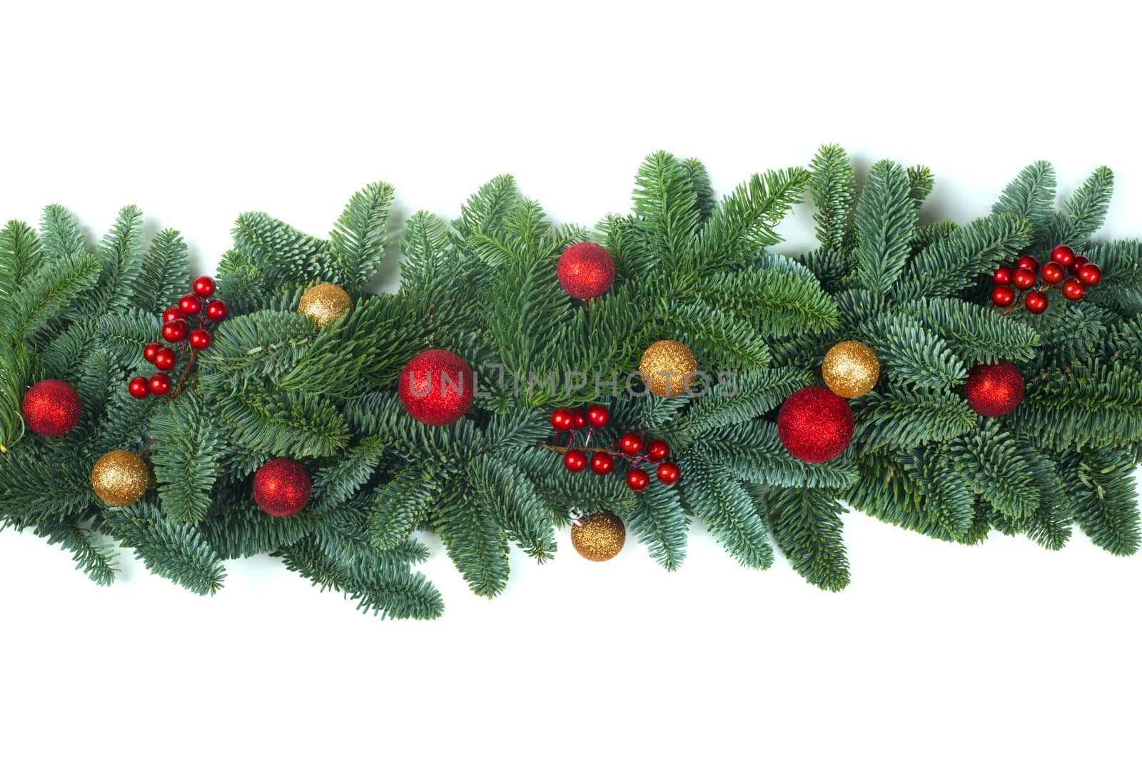 Christmas Border frame of natural noble fir tree branches red and golden baubles isolated on white background