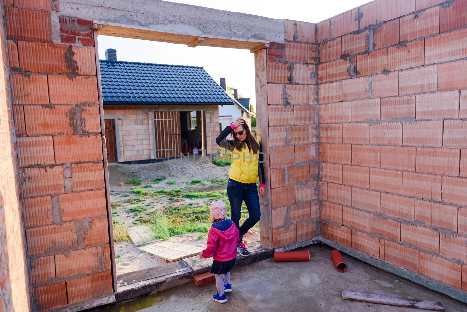 Interior of a Unfinished Red Brick House Walls under Construction without Roofing.