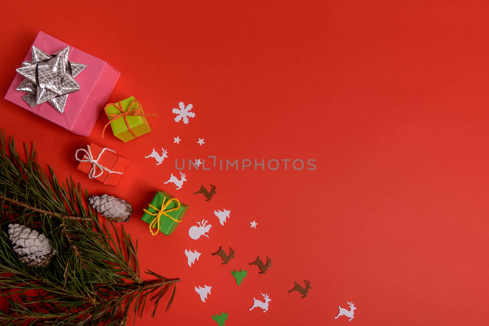 Christmas or New Year background, plain composition made of Xmas decorations and fir branches, flat lay, blank space for a greeting text.