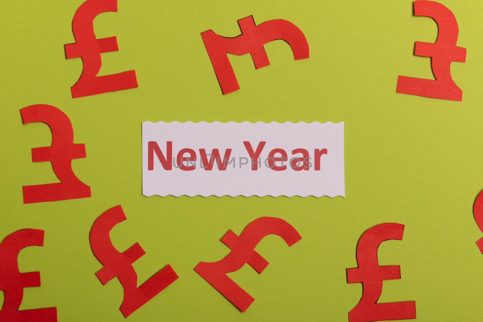 Happy New Year card with paper pund money currency symbol. Conceptual image