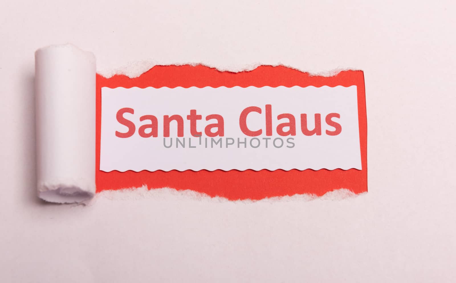 White torn paper with Santa Claus text with red background color. Hidden message. Secret. Copy space
