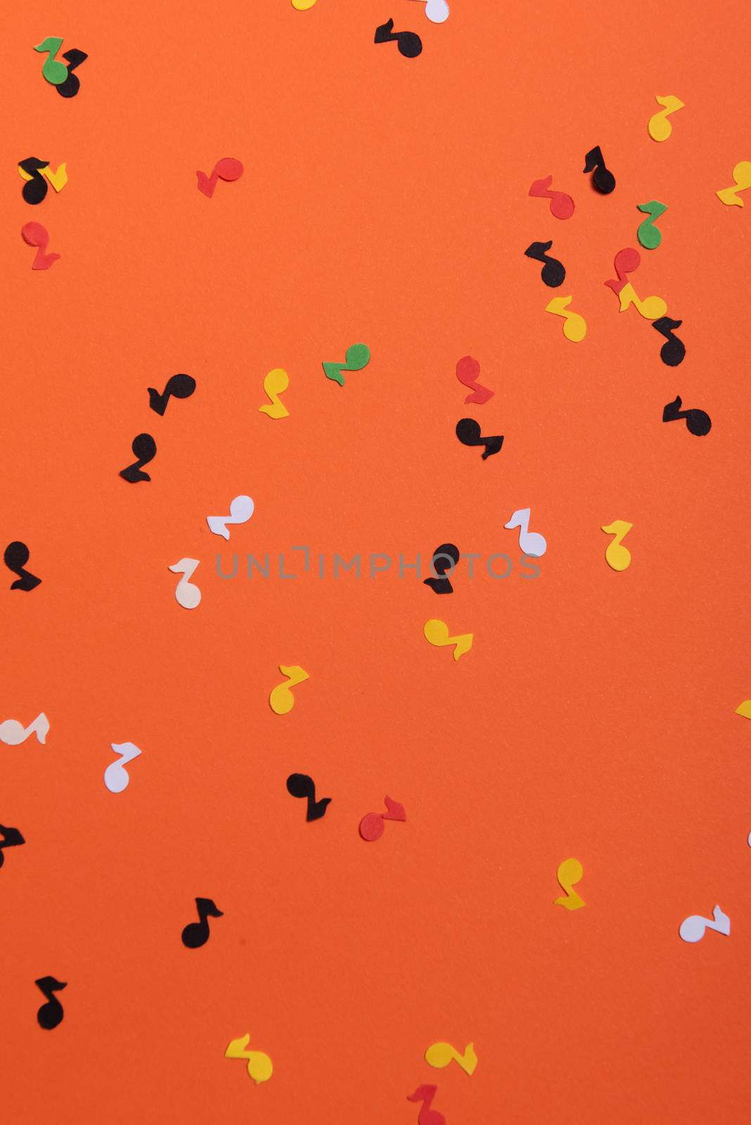 Paper colorful music notes background. View above.