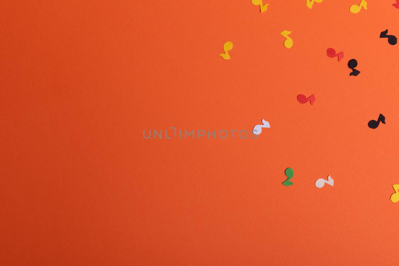 Paper colorful music notes background. View above.