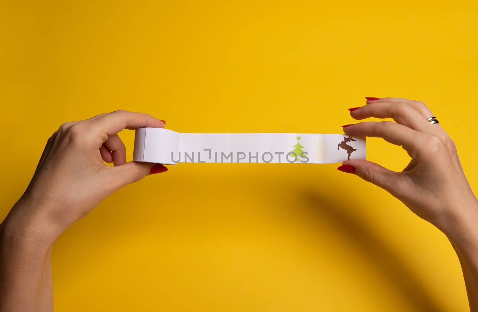 Long twisted expanded empty letter. Copy space. yellow background. View from above