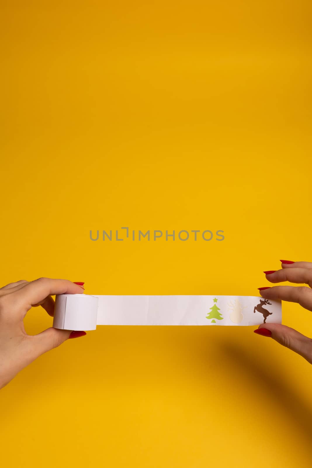 Long twisted expanded empty letter. Copy space. yellow background. View from above