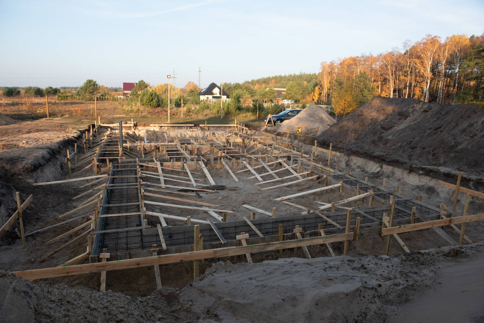 Wooden formwork concrete strip foundation for a cottage.