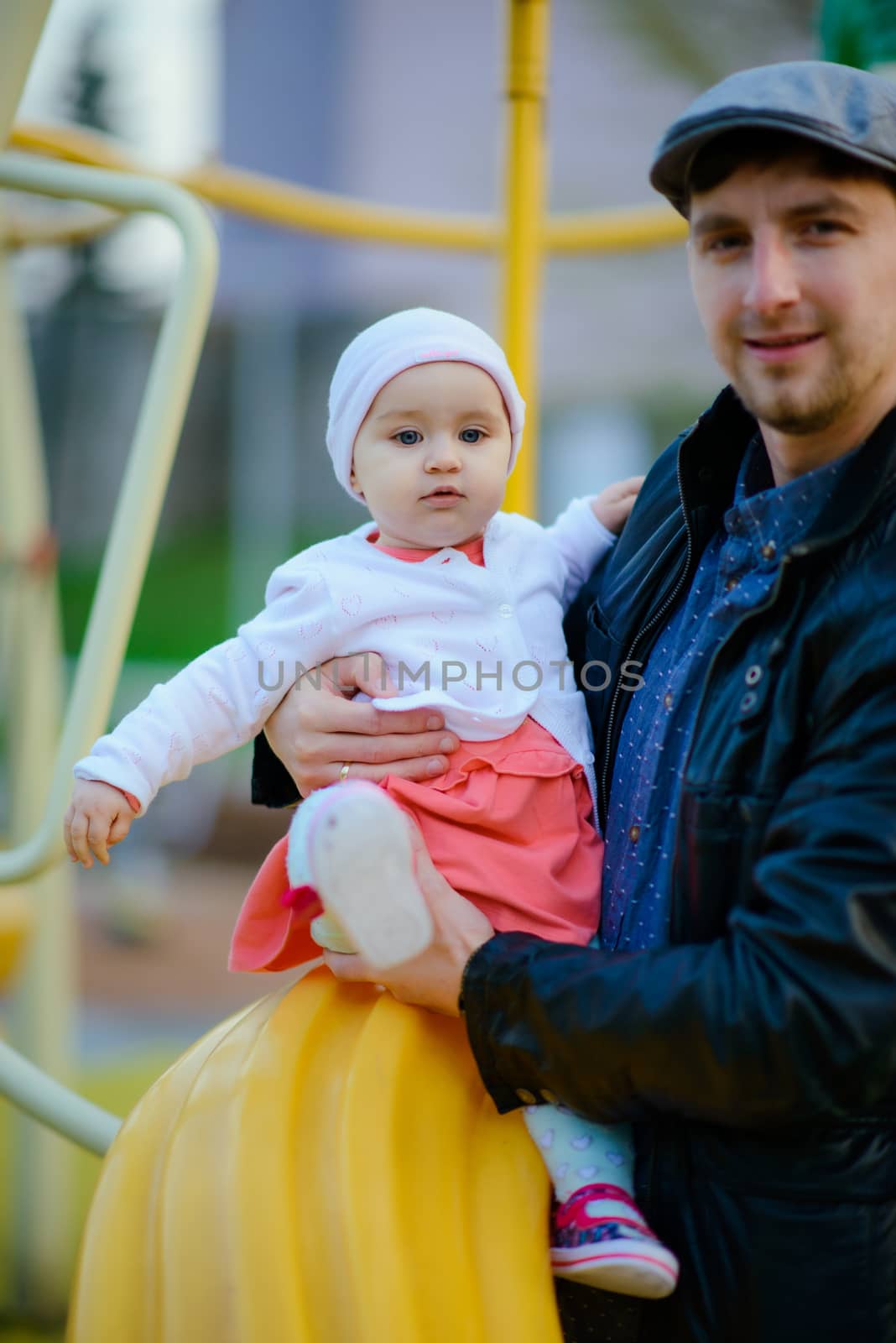 Happy loving family. Father and his daughter child girl playing and hugging outdoors. Cute little girl hugs daddy. Concept of Father's day.