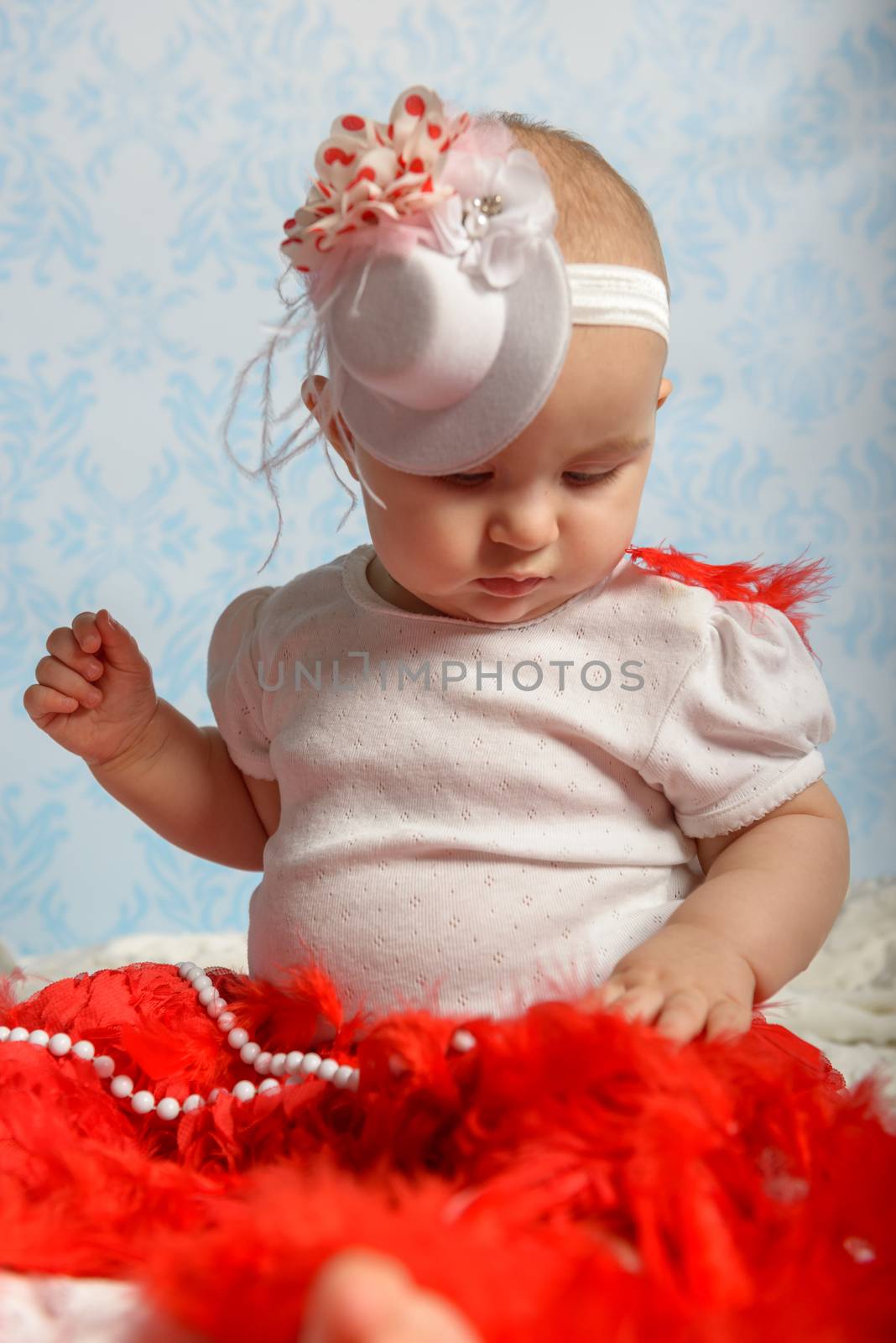 Portrait of adorable baby girl. Childhood.