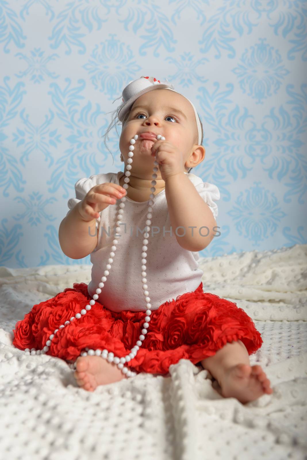 Portrait of adorable baby girl. Childhood.