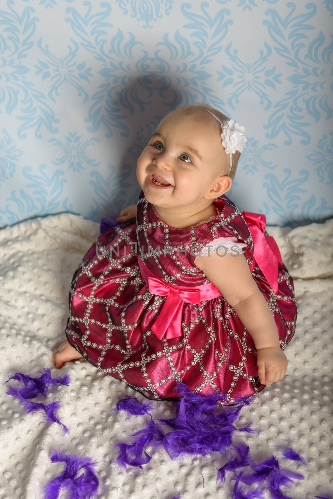Portrait of adorable baby girl. Childhood.