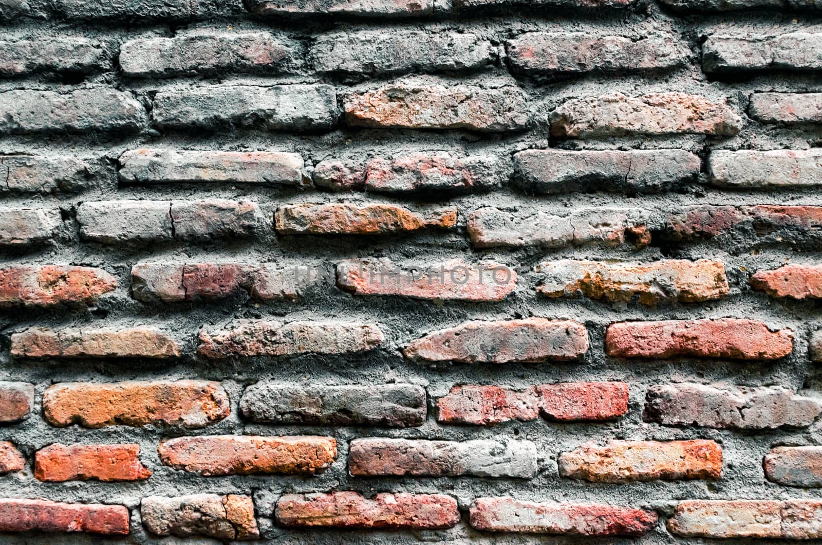 pattern background of old antique rough vintage brick stone wall close up