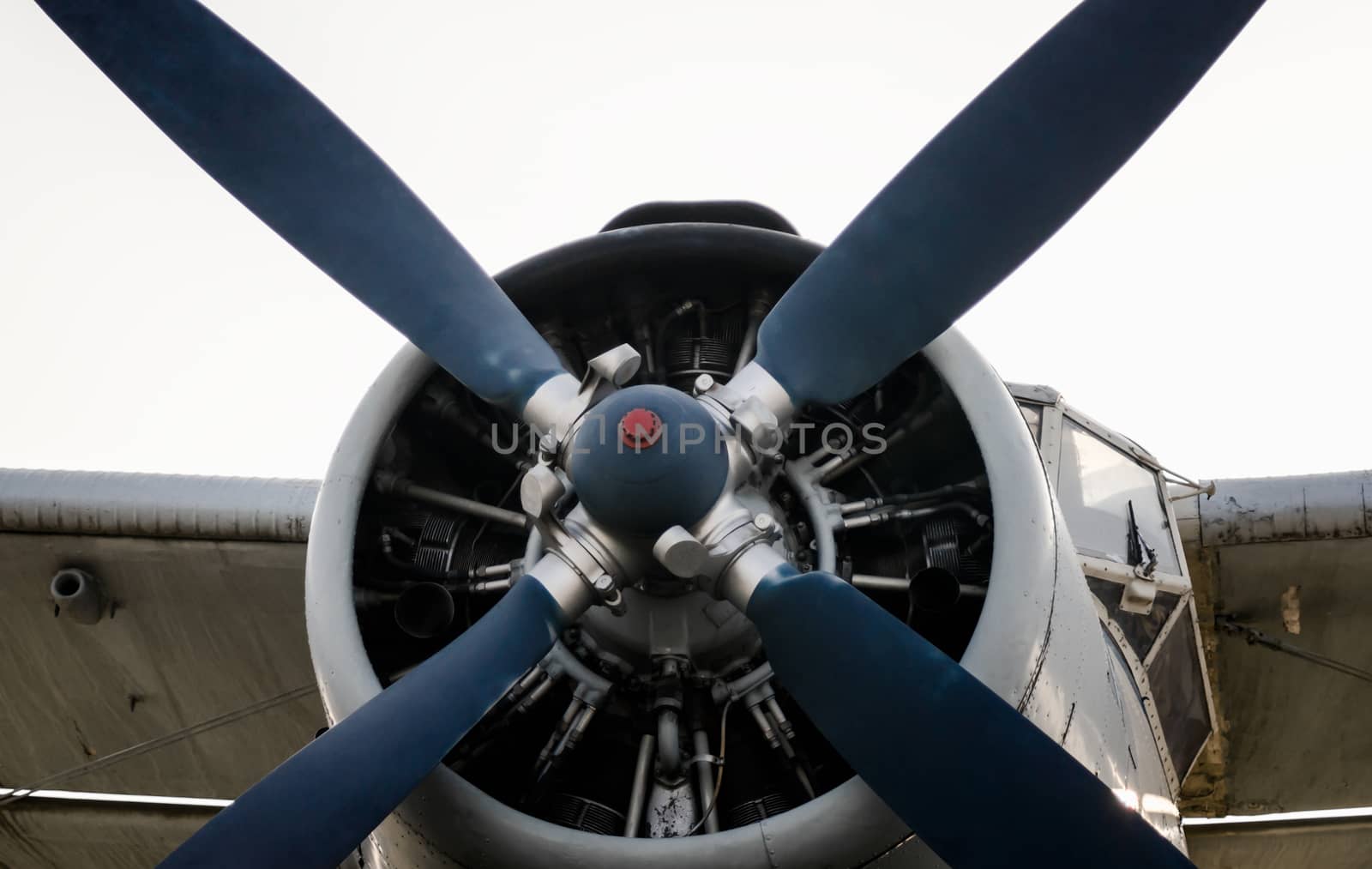 pilot cabin propeller and wing of an old vintage airplane isolated on white background