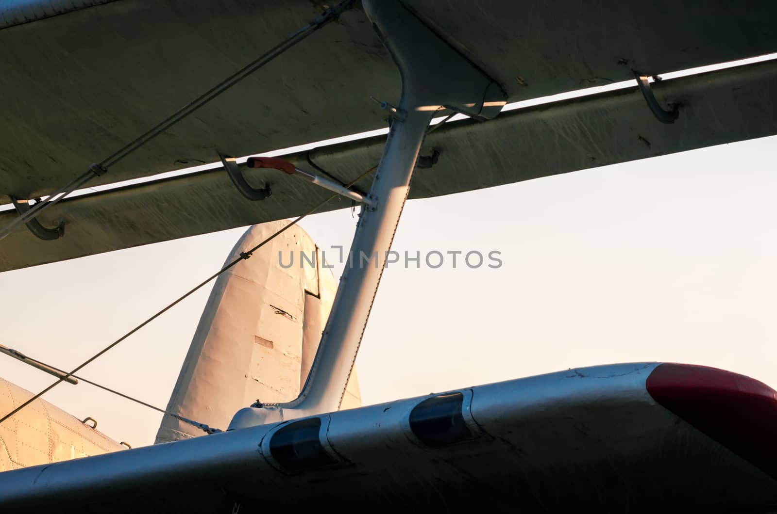 wings of an old vintage airplane against a blue sky