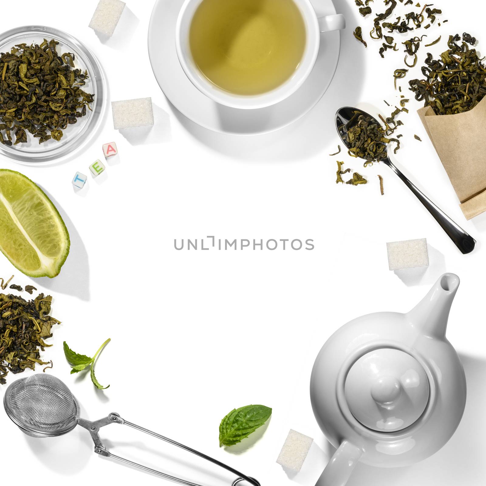 Green tea and accessories top view on white background.