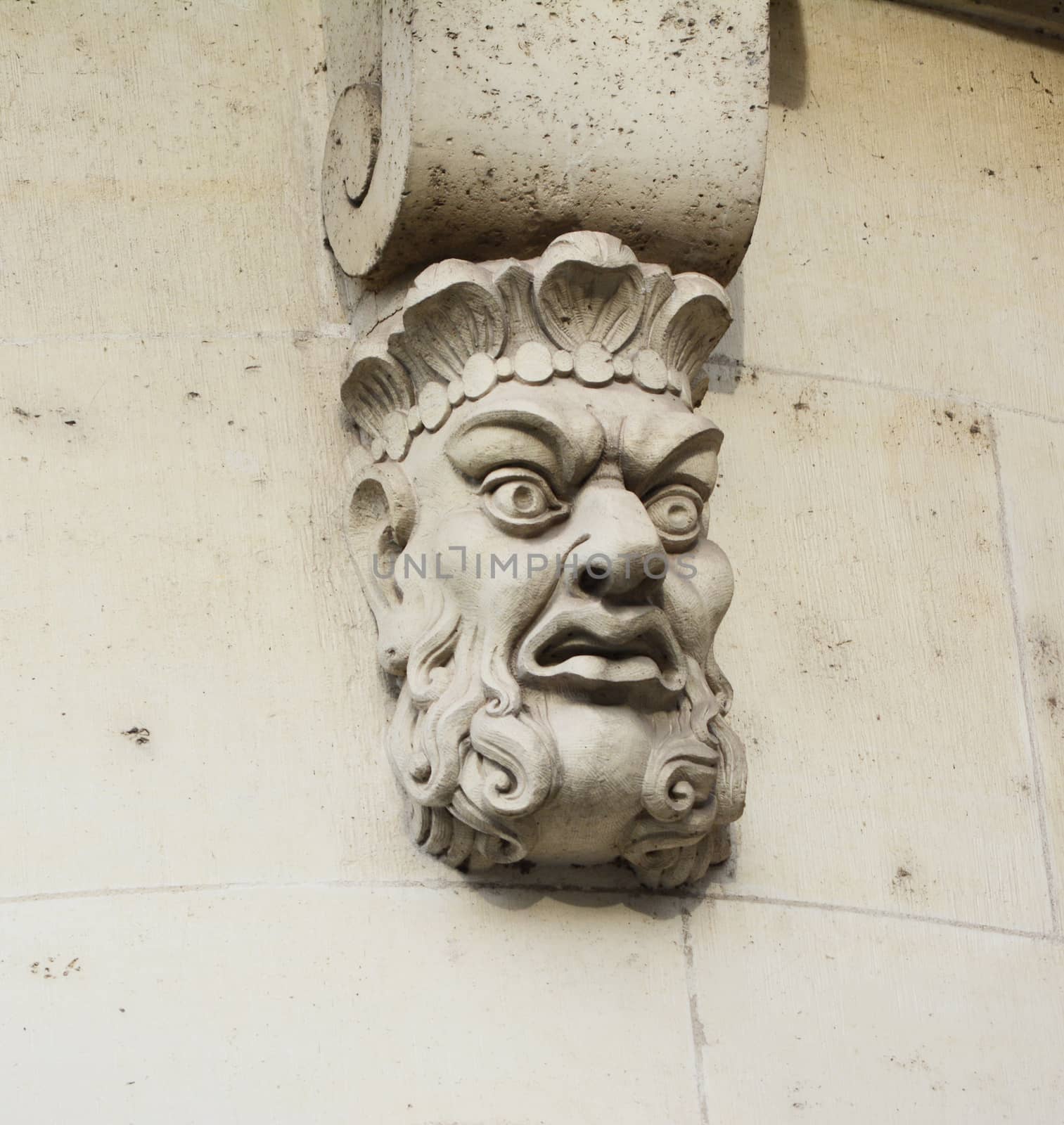 Sculpted stone mask on Pont Neuf in Paris by sarahdoow