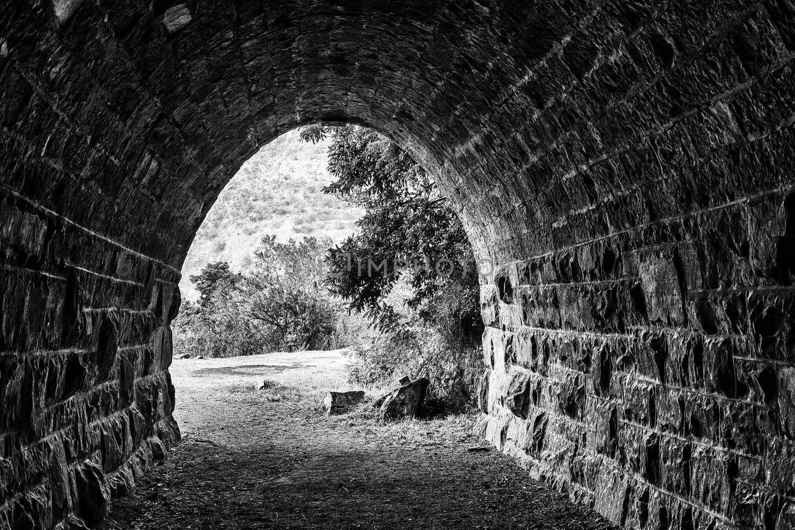 Eastern exit of historic railroad tunnel at Waterval Boven. Mono by dpreezg