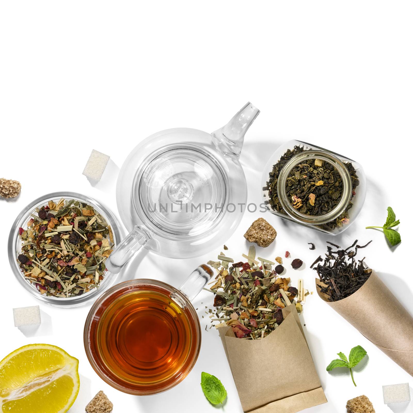 Picking of herbs, berries, tea and accessories. Top view on white background.