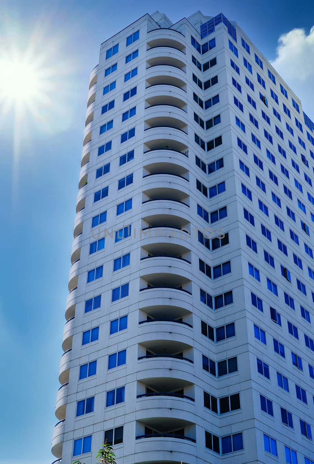White Condo Tower in Sunny Sky