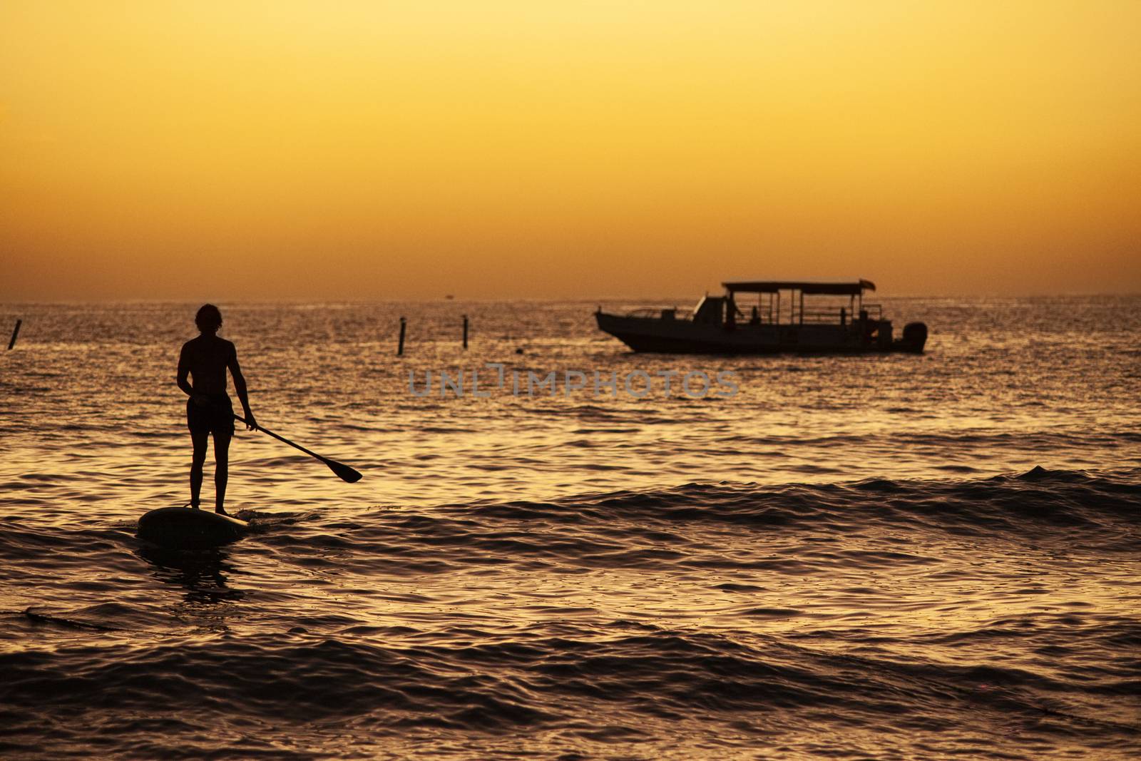 Rowing at the sea at sunset in Bayahibe, Dominican Republic