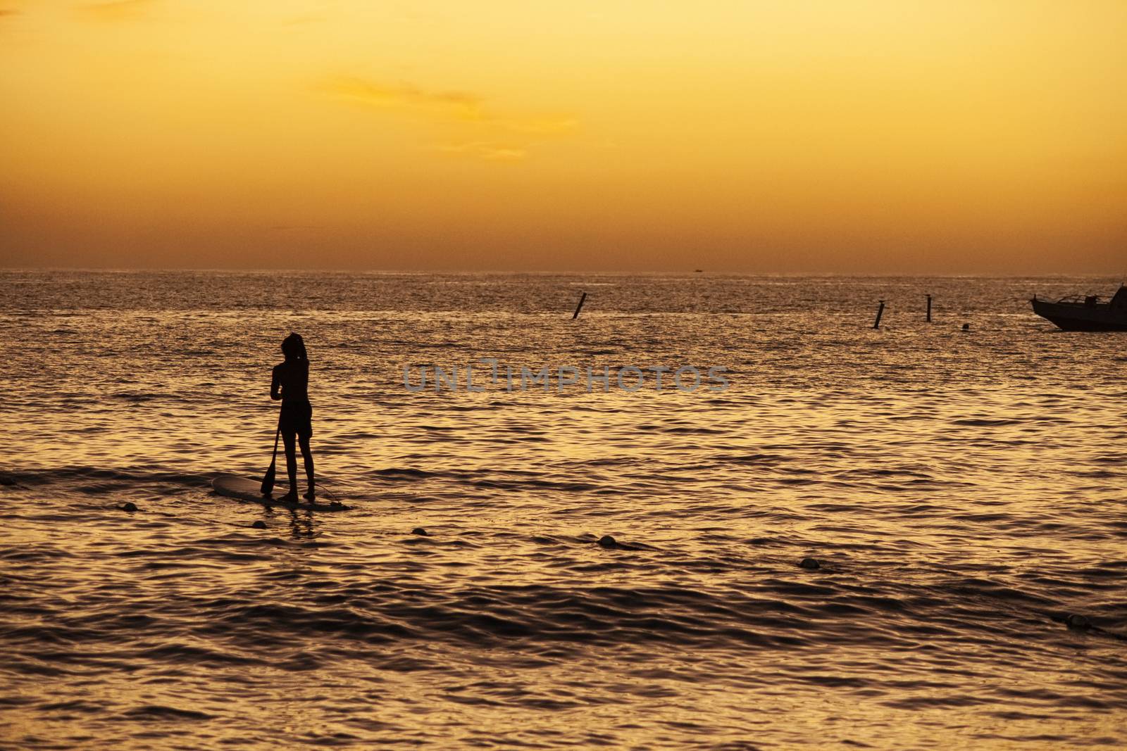 Rowing at the sea at sunset in Bayahibe, Dominican Republic