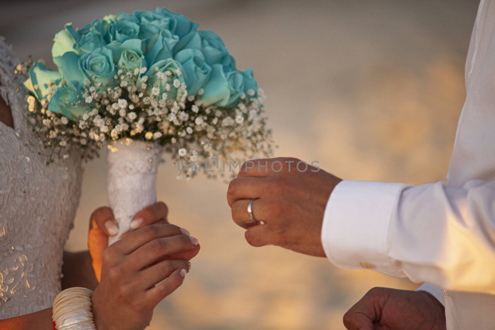 Exchange of wedding rings in caraibic wedding ceremony